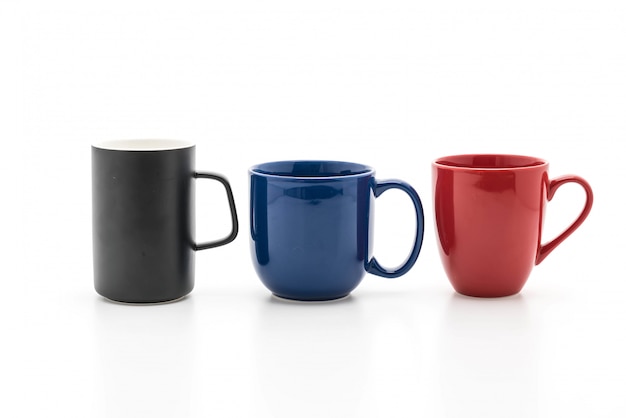 Set of black, red and blue cups on white 