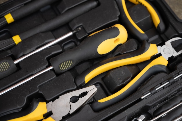 A set of black and yellow tools.