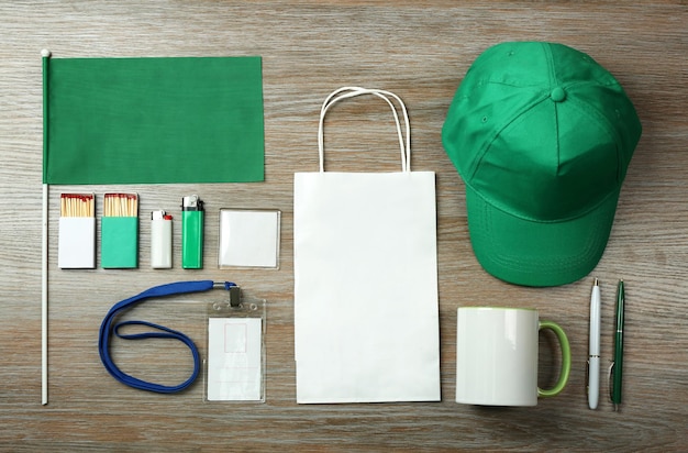 Set of blank items for branding on wooden background