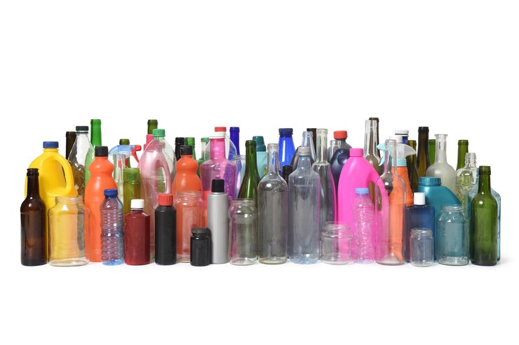 Photo set of bottles glass and plastic containers that are used and are for recycling on white background