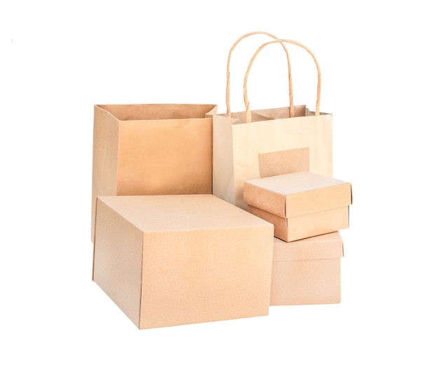 Set of boxes and packages isolate. cardboard brown boxes and disposable eco bags on white