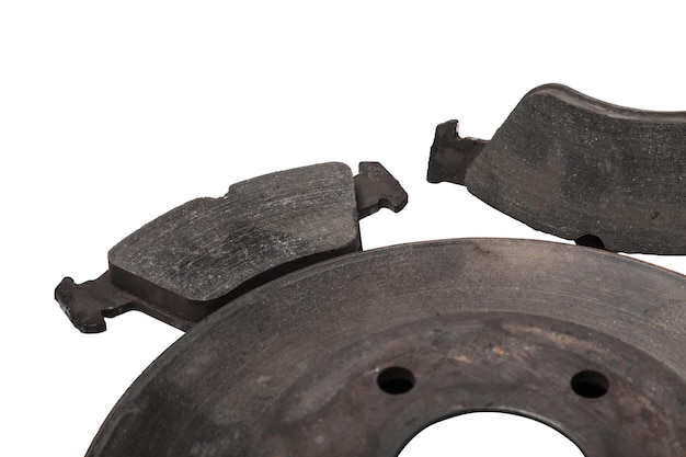 A set of brake pads on a white isolated background in a photo studio of auto parts for replacement during the repair of the chassis or for a catalog of spare parts for sale on auto parsing