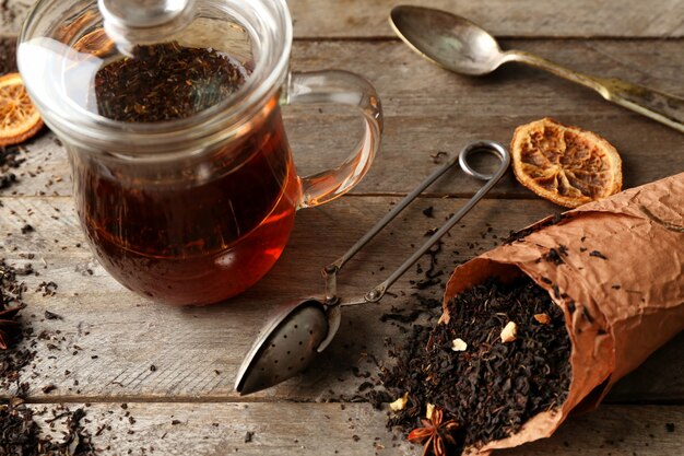 Set for brewing tea on wooden background