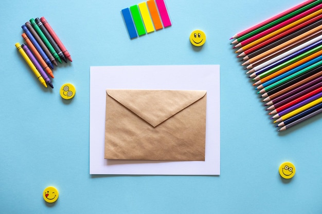 A set of bright stationery items on a blue background Colour pencils