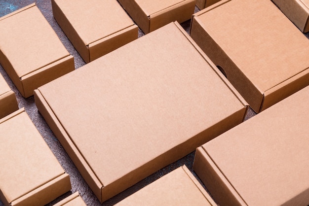 Set of brown cardboard boxes on dark background