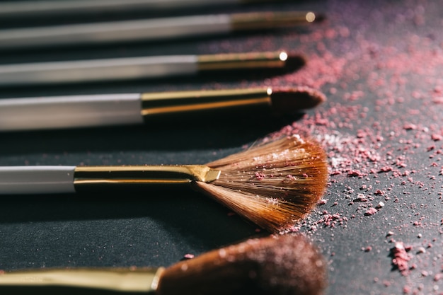 Set of brushes for professional makeup on a black background.photo with copy space