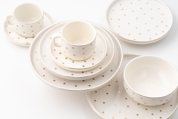 A set of ceramic tableware isolated on white background