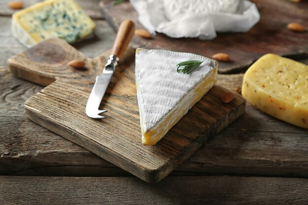 Set of cheese on wooden background