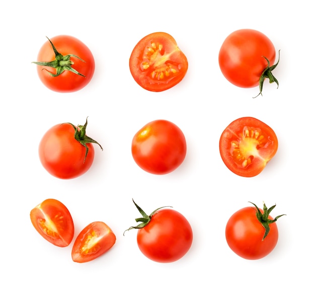 Set of cherry tomatoes, halves and pieces on a white background. Top view.