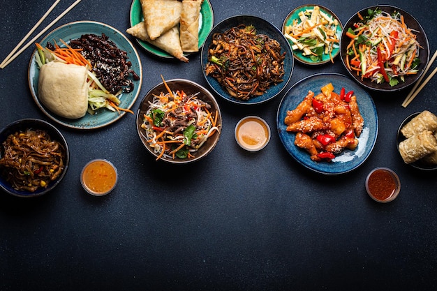 Photo set of chinese dishes on table space for text