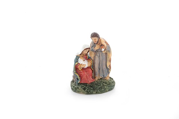 Set of Christmas nativity scene and angel figurines isolated on white background