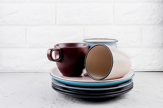 Set of clean tableware on  gray concrete background