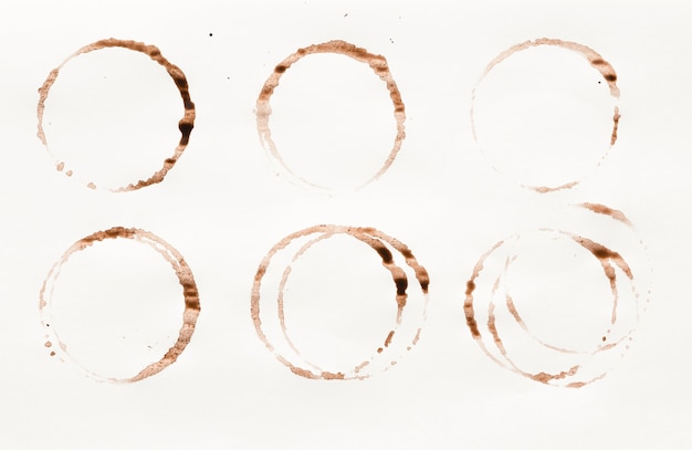 Photo set of coffee cup stains isolated on white background. dry rings of bracing beverage. collection of brown spots for grunge design