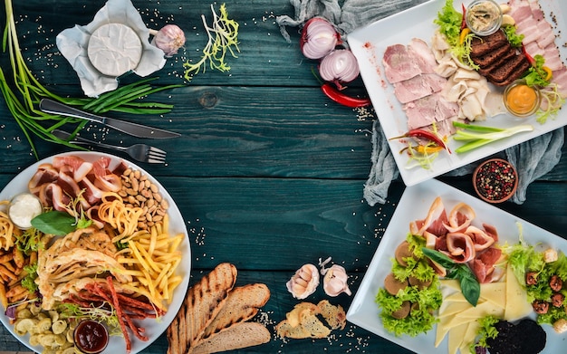 Set cold appetizers Bacon cheese pate Top view On a wooden background Copy space