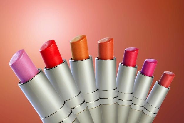 A set of color lipstick on a color background Cosmetics