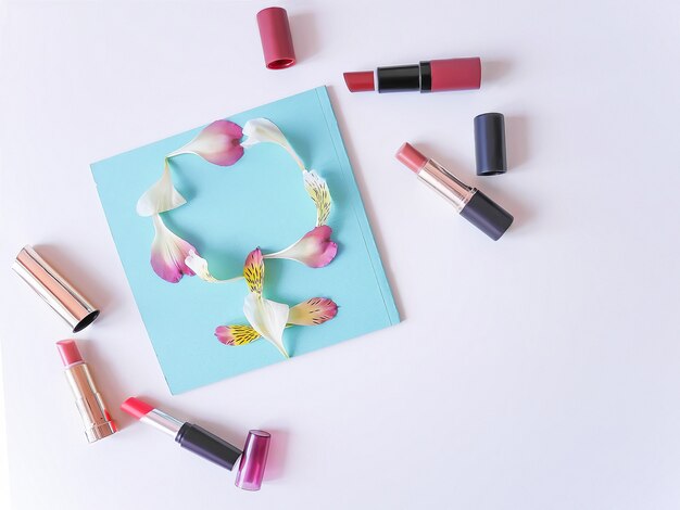 Set of color lipsticks on white background