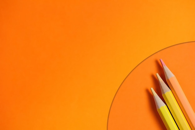 Set of color pencils for drawing on a orange background