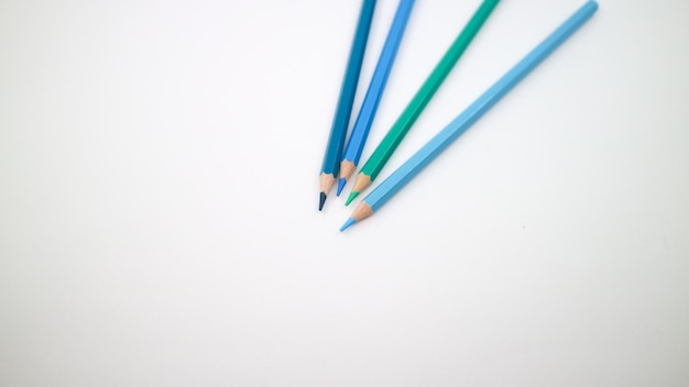 Set of colored pencils blue palette isolated