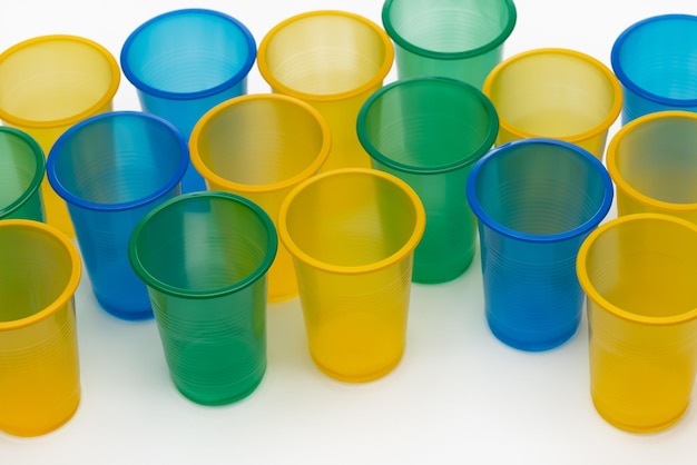 Photo set of colorful disposable cups for drinks, studio shot. plastic recycling.