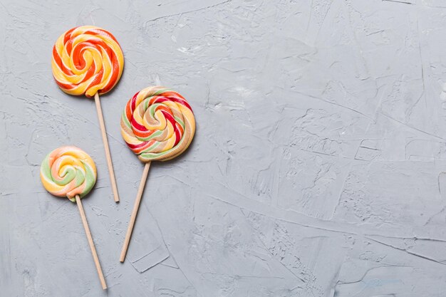 Set of colorful lollipops on colored background Summer concept Party Happy Birthday or Minimalist Concept