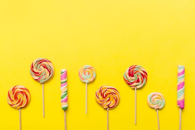 Set of colorful lollipops on colored background Summer concept Party Happy Birthday or Minimalist Concept