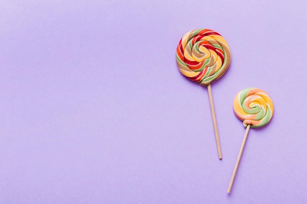 Set of colorful lollipops on colored background Summer concept Party Happy Birthday or Minimalist Concept