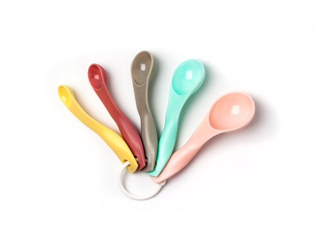 Set of colorful plastic measuring spoon isolated on white