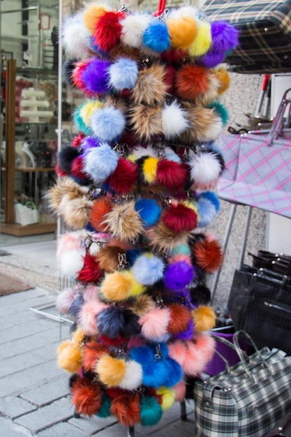 Set of colorful pompoms in the bazaar