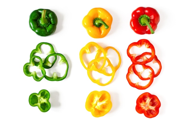 Photo set of colorful sliced bell pepper isolated on white slices of red yellow and green bell pepper