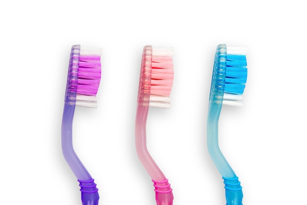 Photo set of colorful toothbrushes isolated over white wall