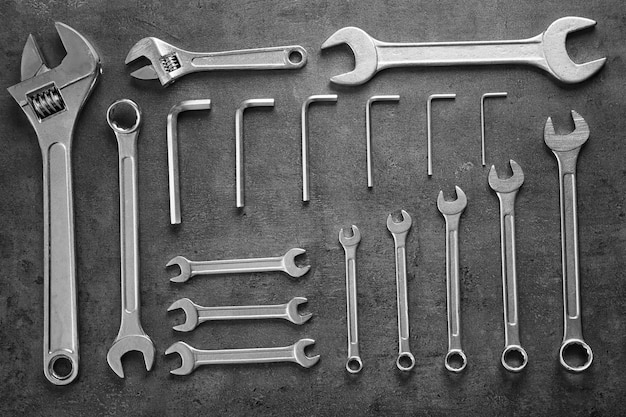 Set of combination wrenches on gray background