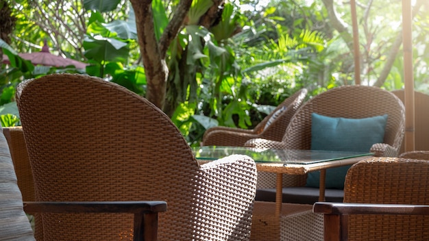 A set of comfortable thatched armchairs and table