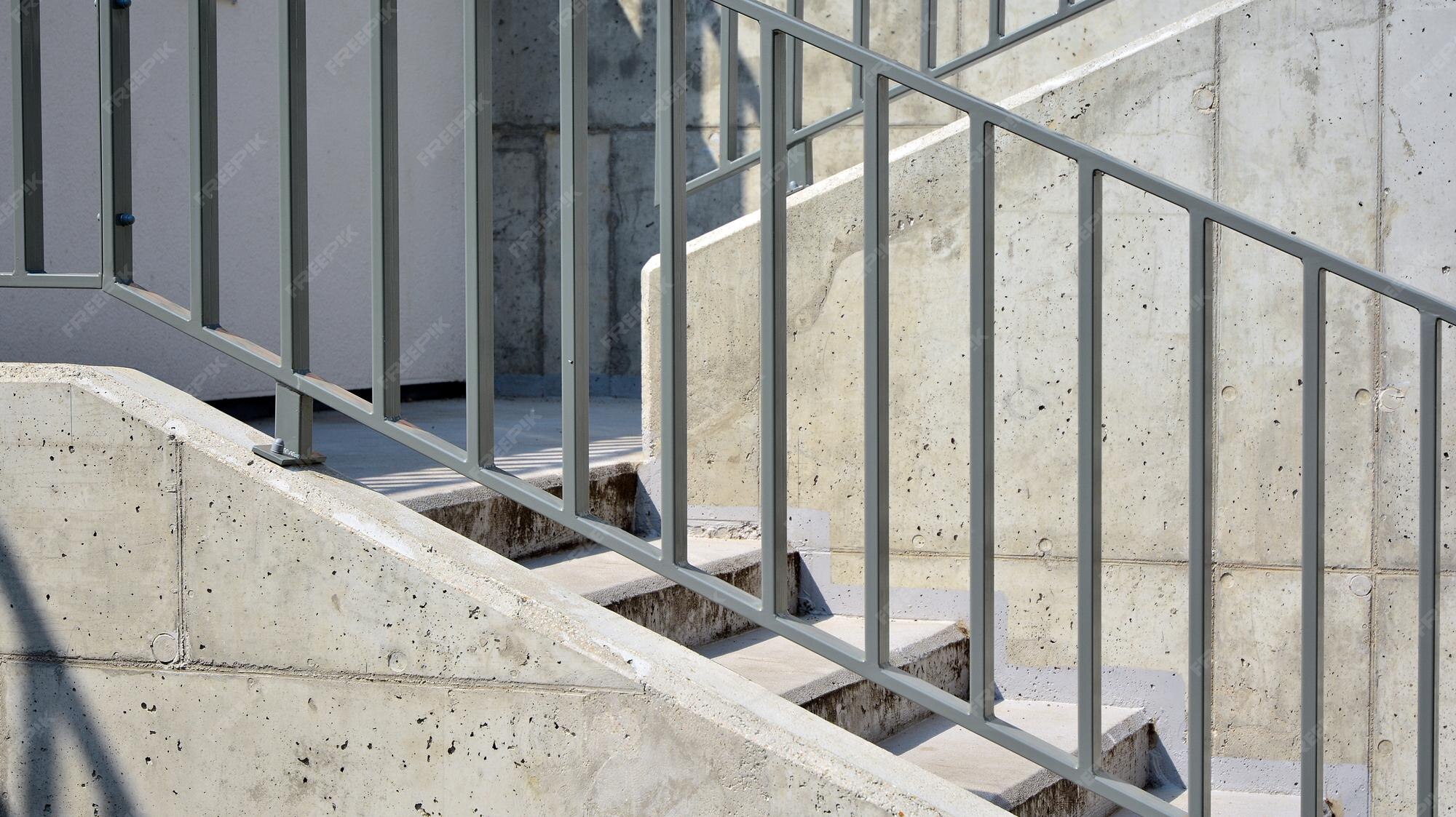 Premium Photo | A set of concrete stairs with a metal railing that has