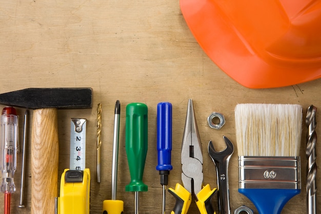 Set of construction tools and instruments on wood background