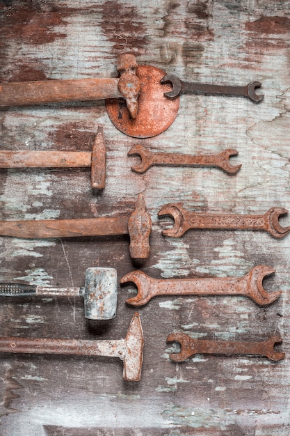 The set of construction tools on wooden table