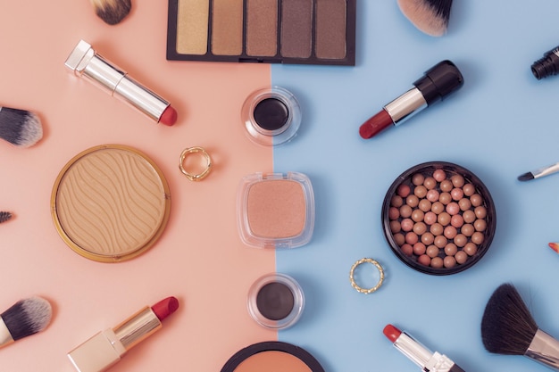 A set of cosmetics on a bluepink background