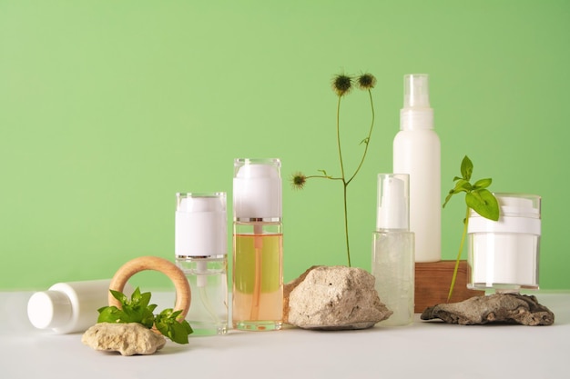 A set of cosmetics products with natural materials on a green background natural organic cosmetic