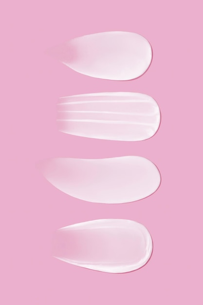 Photo set of cream texture smears on pink background