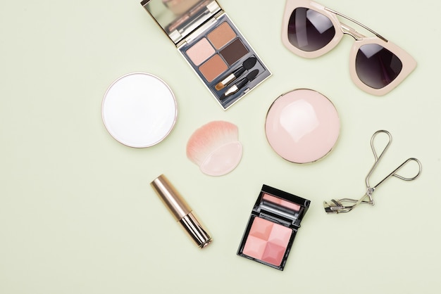 set of decorative cosmetic products on color background