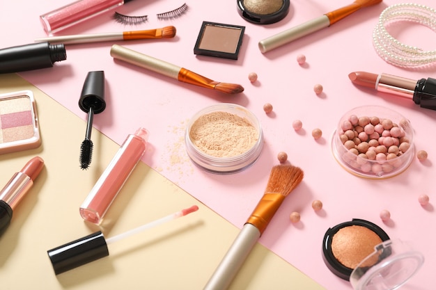 Set of decorative cosmetics on a colored background