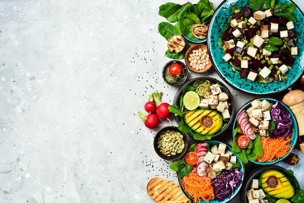 Set of detox Buddha bowl Vegetarian food The concept of healthy eating On a stone background Top view