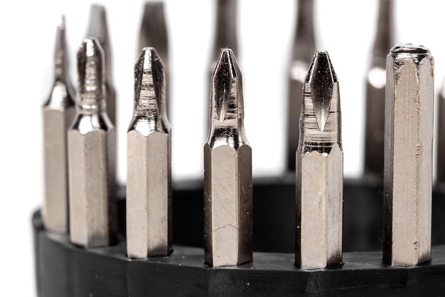 A set of different attachments for a head screwdriver with a screwdriver on a white background