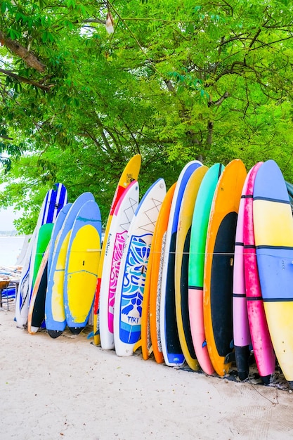 Set of different bright colorful surf boards in a stack