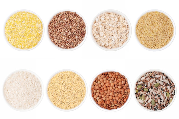 Set of different cereals rice buckwheat corn millet bulgur oatmeal in bowls