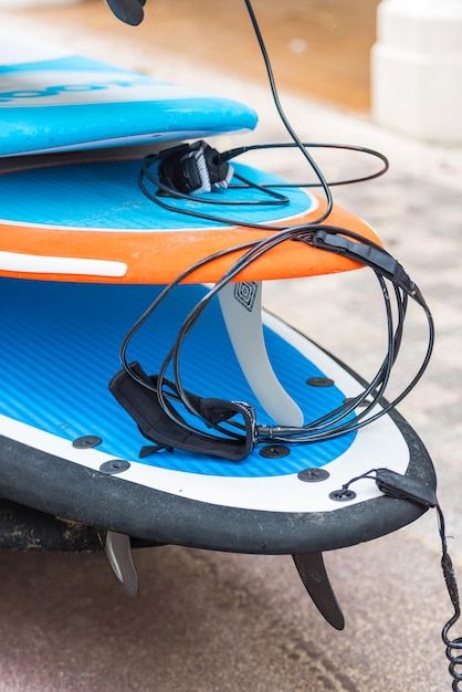 Set of different color surf boards in a stack. France