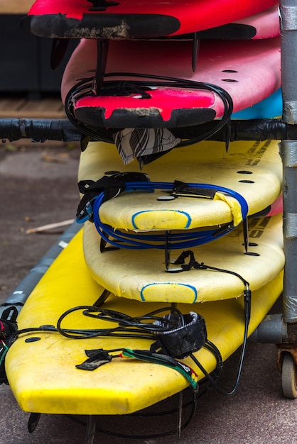 Set of different color surf boards in a stack. France