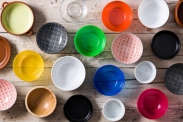 Set of different empty bowls on table