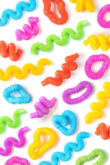 Photo set of different forms and colors, trendy kids toys ã¢ââ pop-tubes. white background with colorful kids toys.