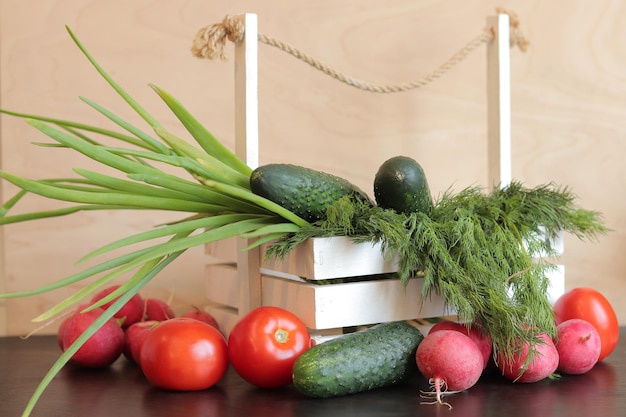 Set of different fresh vegetables closeup Wooden white basket with harvest