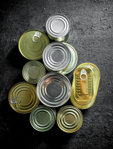 Set of different kinds of tin cans with canned food